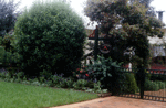 Entrance to Karlyle Cottage; the simple design creates contrast and heightens the impact of features within the garden.
