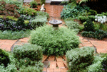 The sundial provides a focal point in the centre of the front garden.