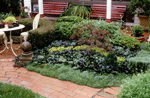 Wrought iron garden furniture provides a both a visual feature and a wonderful spot to sit and have a drink.