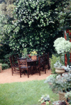 This outdoor setting in the first section of the back garden is a place for summer barbeques.